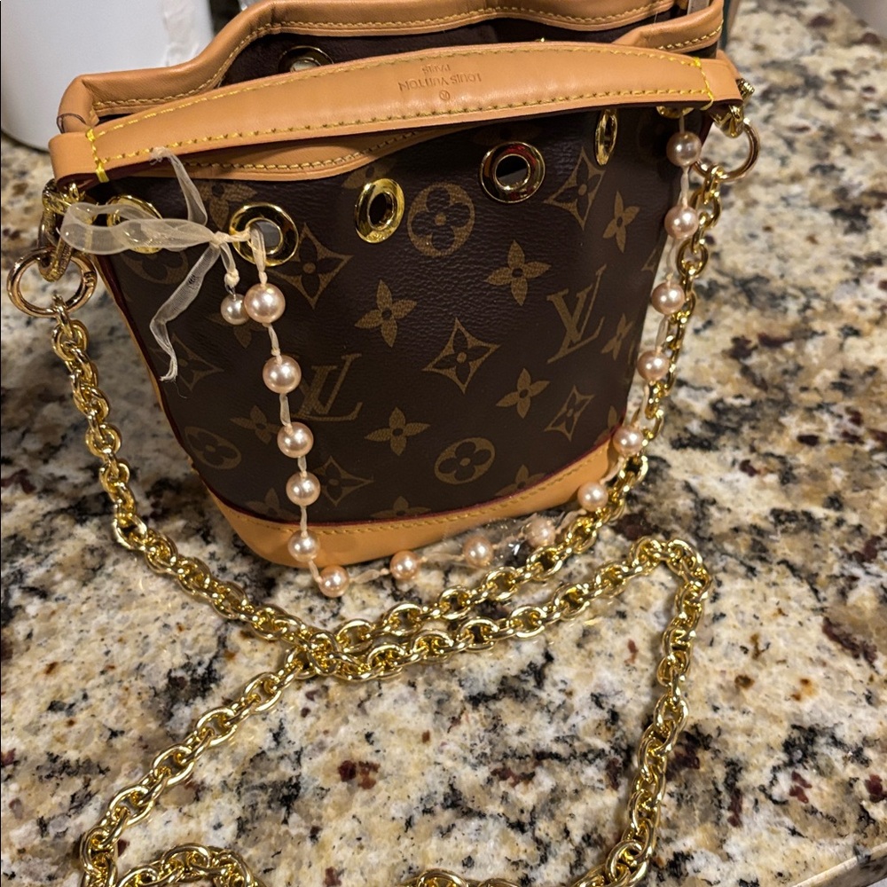 Louis Vuitton Brown and Gold Mini nano noe mini sold As-is (
No Cancellations).